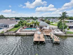 Palm Tree Retreat - Lakefront with Pool & Fire Pit