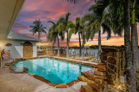 Palm Tree Retreat - Lakefront with Pool & Fire Pit - Image 1