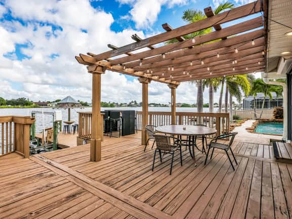 Palm Tree Retreat - Lakefront with Pool & Fire Pit