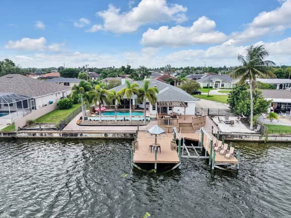 Palm Tree Retreat - Lakefront with Pool & Fire Pit